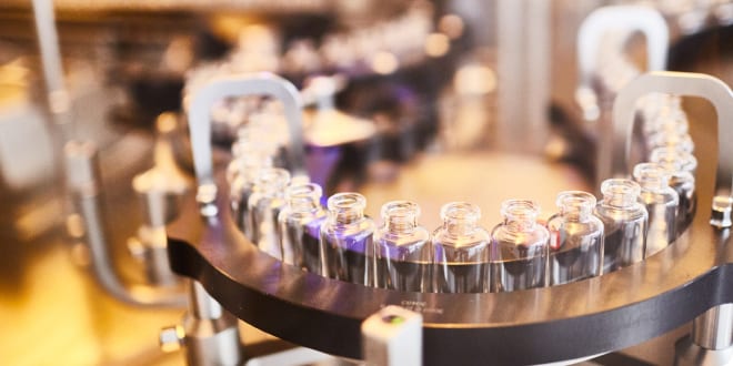 Steriscience scientists inspecting sterile injectable samples in the laboratory